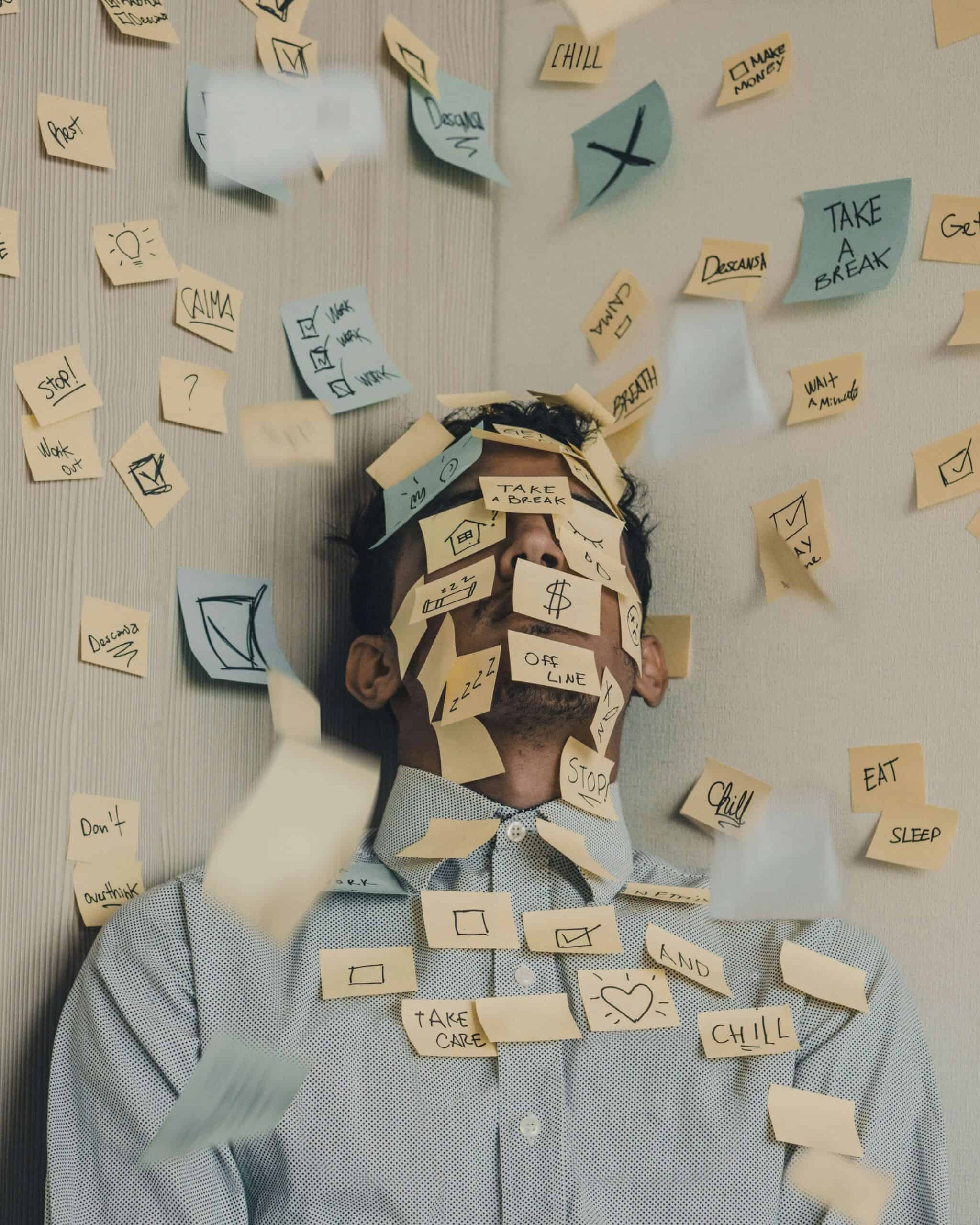 Man Covered in Post Its with Habits